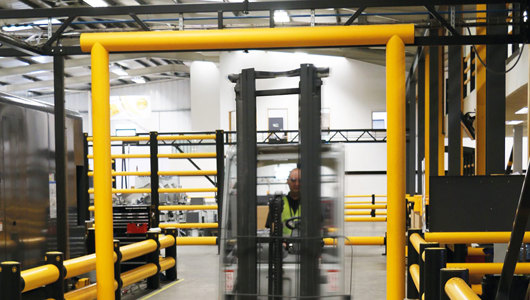 Height restrictor industrial doorway protection in factory