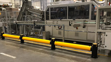 Industrial guardrails protecting machinery