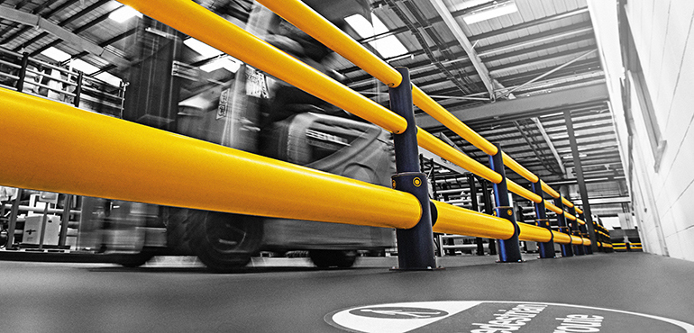 Workplace Safety Barriers: Barriers line a facility to segregate forklift trucks from machinery