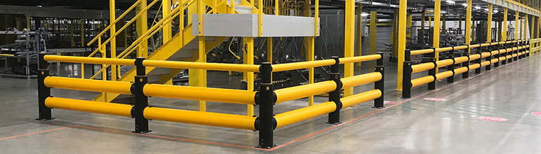 Workplace Safety Barriers: A range of different barriers protect a stairwell and other parts of a factory